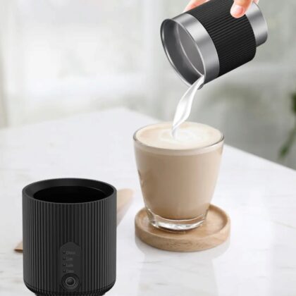 Lepresso Foamflex electric frother pouring rich milk foam into a cappuccino glass
