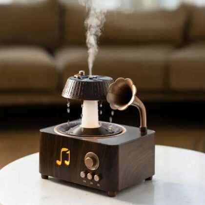Porodo concord aroma diffuser and Bluetooth speaker placed on a wooden shelf for home relaxation