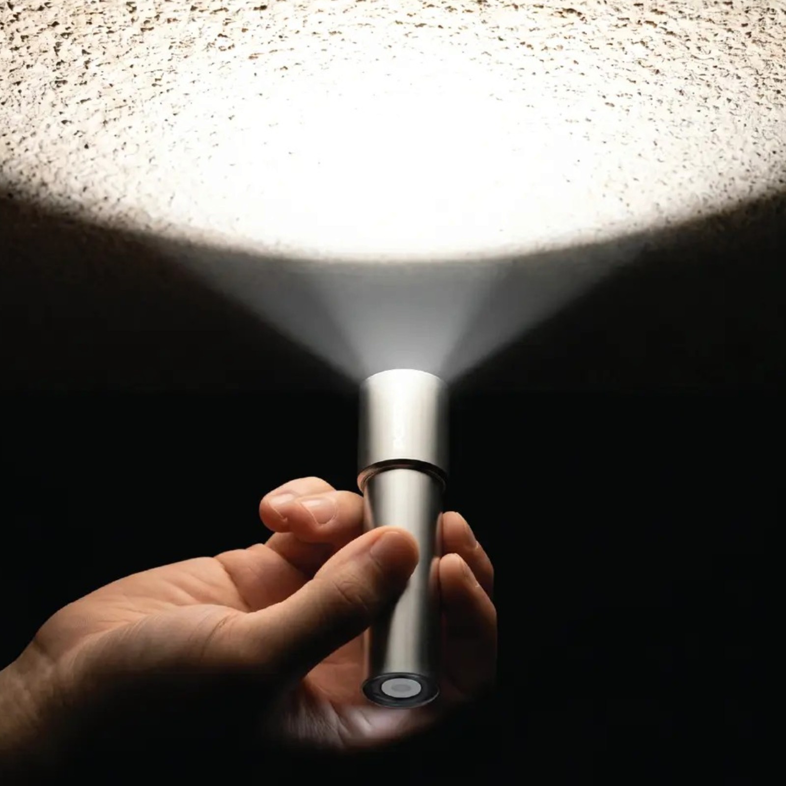 Porodo Sol Lite Mini Portable Torch Light with Rechargeable battery - Silver (2) Porodo Sol Lite compact torch light held with wrist strap during night outdoor use